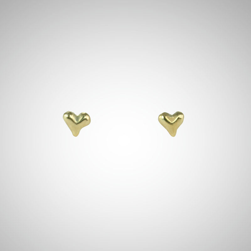 Jeffrey has been carving hearts from the beginning. These are his most tiny, carved by hand in wax before being cast in precious metals. Perfect for layering as multiples. Shown in yellow gold