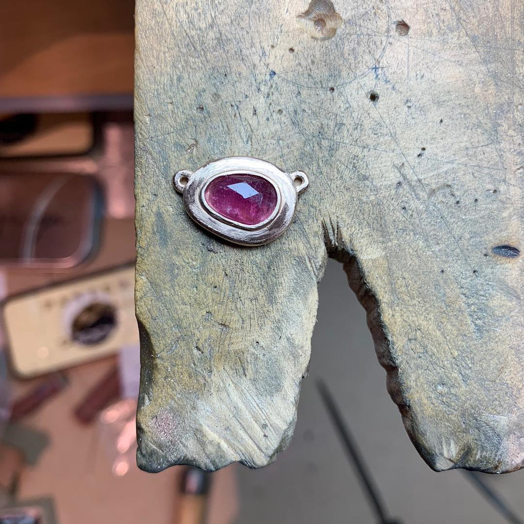 This gorgeous pink tourmaline gem is set in a hand carved rose gold setting to feature its rubellite color in the most brilliant way. Process.