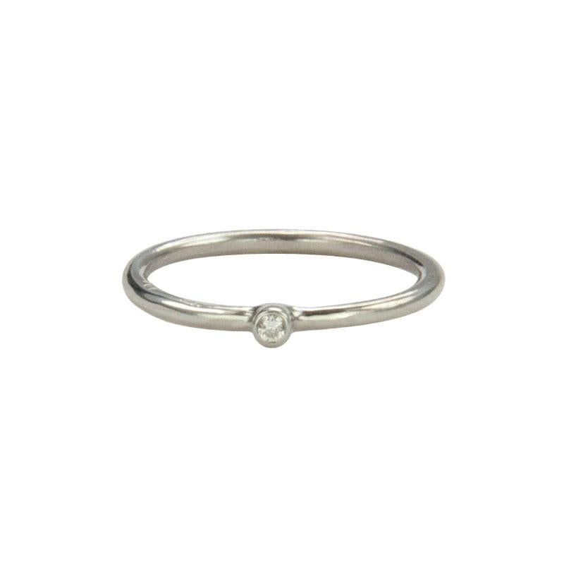 Jeffrey Levin Super Skinny stacking ring in 14K white gold with single stone white diamond is delicate and designed for stacking.
