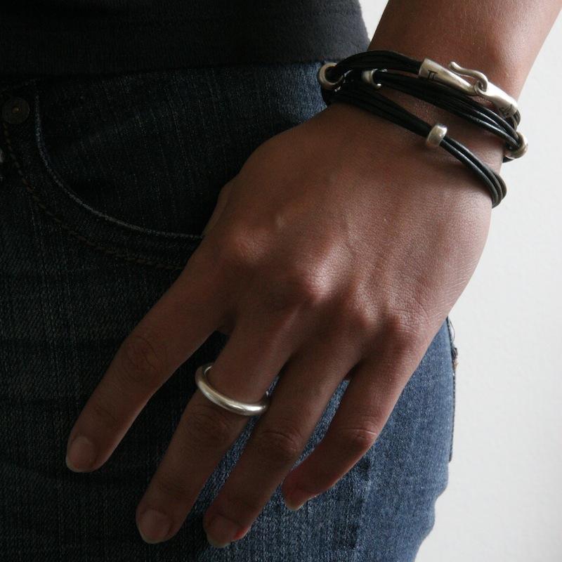 Stunning layered or alone–goes with everything, thick round stacking rings by jewelry designer Jeffrey Levin. Mixed metals available in sterling silver; 14k yellow, white or rose gold; or platinum. Shown on model with Jeffrey Levin triple wrap leather bracelet.