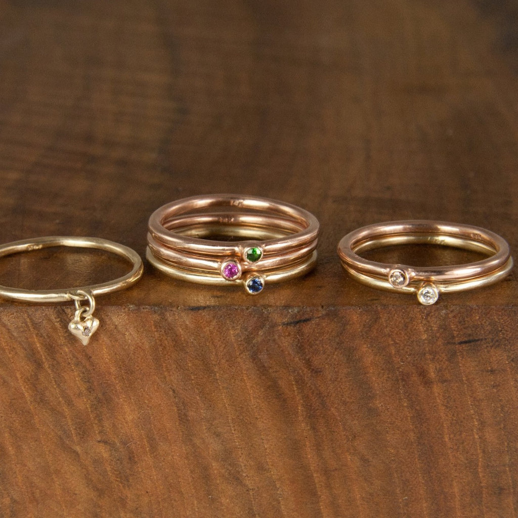 These super skinny stacking rings by Jeffrey Levin are adorned with single stones in your mix of precious metals and gems. They're are delicate, simple and personal. Wear alone or stack with your blend of plain, 3-stone burnished or other single-stone bezel set skinny rings in mixed metals and with diamonds or colorful gems.
