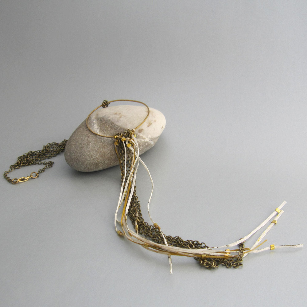 This is one of our fave pieces with its gathering of long chain and Japanese paper. 