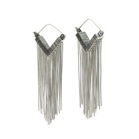 Always stay grounded. These Mariella Pilato earrings feature a cascade of silver wires resting in the air as if the aerial roots of a plant. Front view.