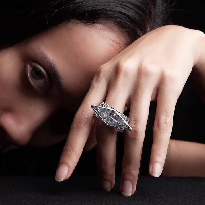 Mariella Pilato designed to catch rays of light with this symmetrical pair of rough-hewn crystal ring.