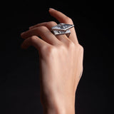 Catch rays of light with this symmetrical pair of rough-hewn crystal ring.