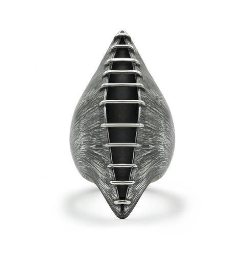 When you like a bold big ring... This dramatic elongated pod of polished bands of silver wire are constructed over a heavily etched silver container which opens slightly, revealing an oxidized interior.  Top front view.
