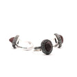 The rough faces of the garnets were found to be intriguing combined with the effect realized by powdering silver and then soldering and oxidizing the it onto the ring itself. 