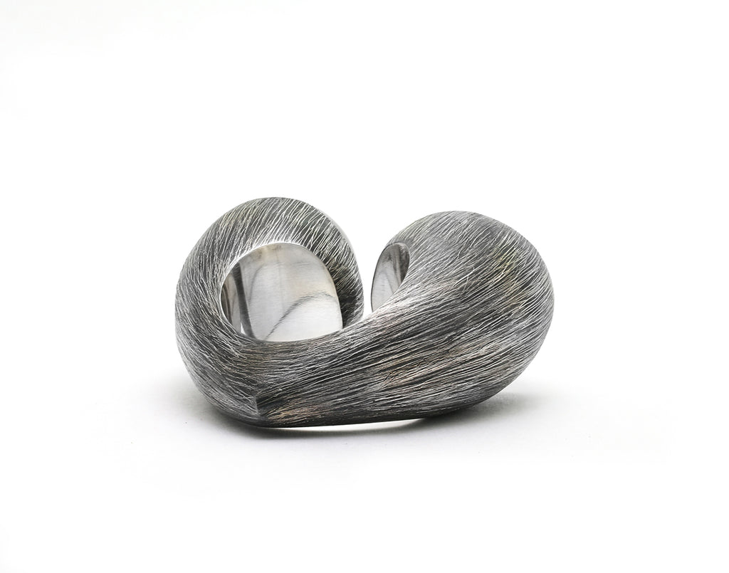 Mariella Pilato Crystal Heart Rings. Heart construction wraps around your finger with bold crystal domes on each peak, set in an etched and oxidized band. Back view of heart construction.