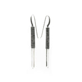 Subtle, elegant and streamlined bold. Mariella's Wand earrings are designed using a crystal point embraced in etched silver, which captures the crystal point crested by a heron’s neck.