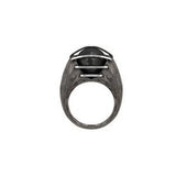 A luminous, natural inky-black colored Tahitian black pearl is enclosed in a heavily etched container, held in place by parallel bands of high polished silver designed by Mariella Pilato. Front view.