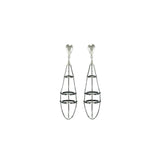 Stunning construction that exists in a space where the industrial and artistic meet. Mariella Pilato designed these light weight earrings inspired by a spider's web. 