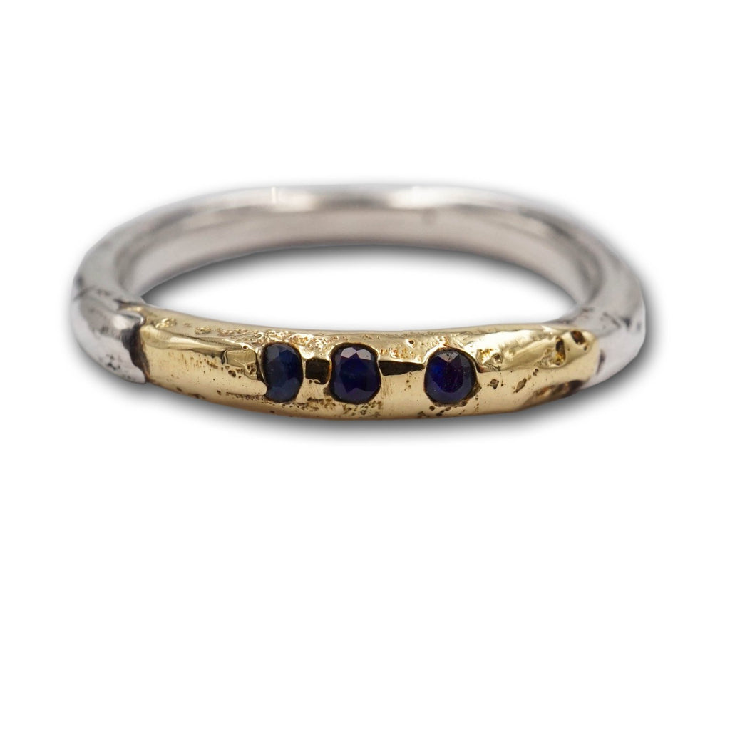 Mixed metals of 14K gold and sterling silver Mel collection stacking band with cast in place sapphires add covetable drama to your ring stack! With a wabi-sabi aesthetic, they look amazing as a single or stack! Each is made individually!
