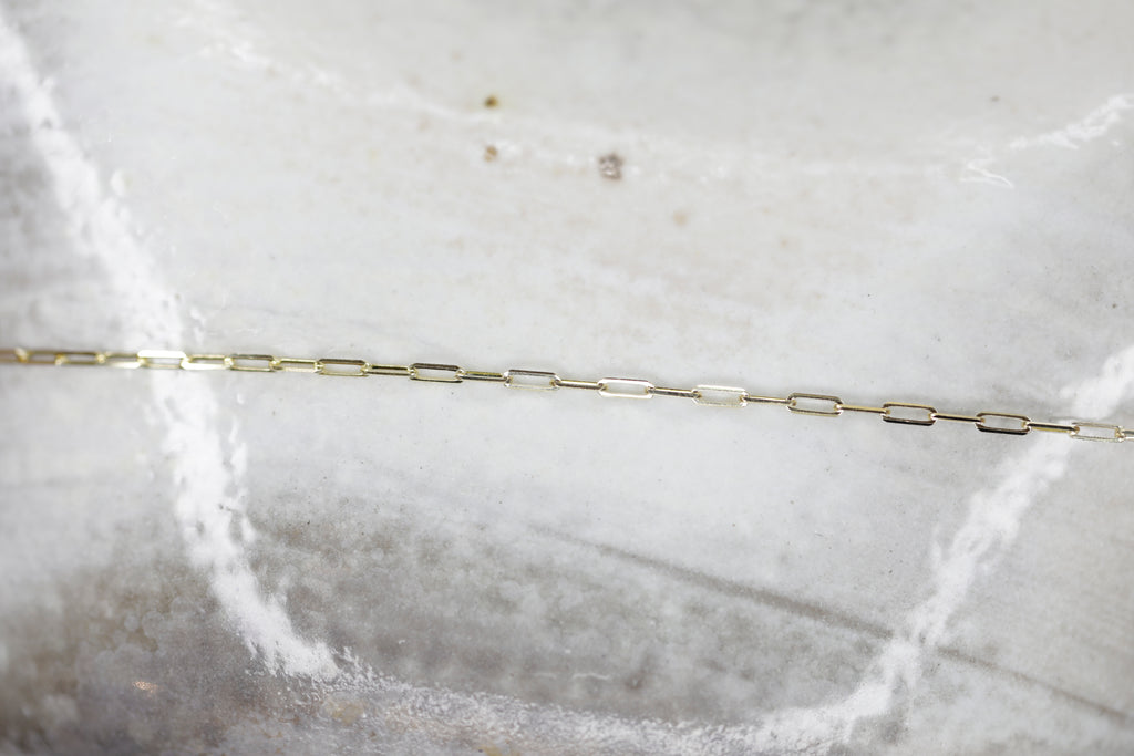 We love the paperclip link chain for its elongated modern look. Permanent Jewelry Tiny Paperclip Chain Link Bracelet. Get Linked at Poet and/the Bench in Mill Valley. 