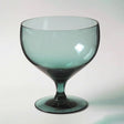 These teal Russel Wright water glasses... or a goblet for a shrub, sparkling craft soda or juice and add fresh color to your bar and table.