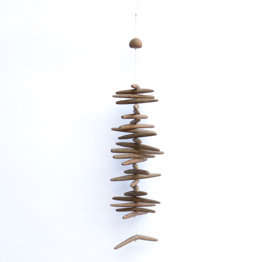 The Toothy is a hand built ceramic wall hanging with references to driftwood and other natural materials. The freeform shapes have a visceral quality, inspired by observations of landscape, the natural world, textiles, and metallic elements. 