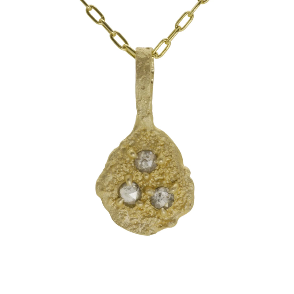 Hand sculpted 14k gold and salt and pepper diamonds pendant by Talking Tree Jewelry with earthen texture and a scattering of grey diamonds
