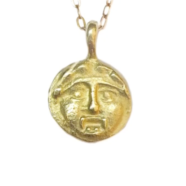 Hand sculpted 14k gold face of the Gorgon, a symbol of protection attributed to mythical female creatures from Ancient Greece.