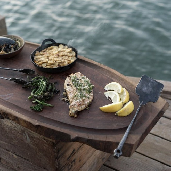 Hand forged grill spatula is both artful and functional. Bought individually or as part of a three-piece set–all pieces are beautiful and robust yet lightweight. A Terasu design collaboration between Oakland and Sausalito based metalsmiths.  Grill set shown in use.