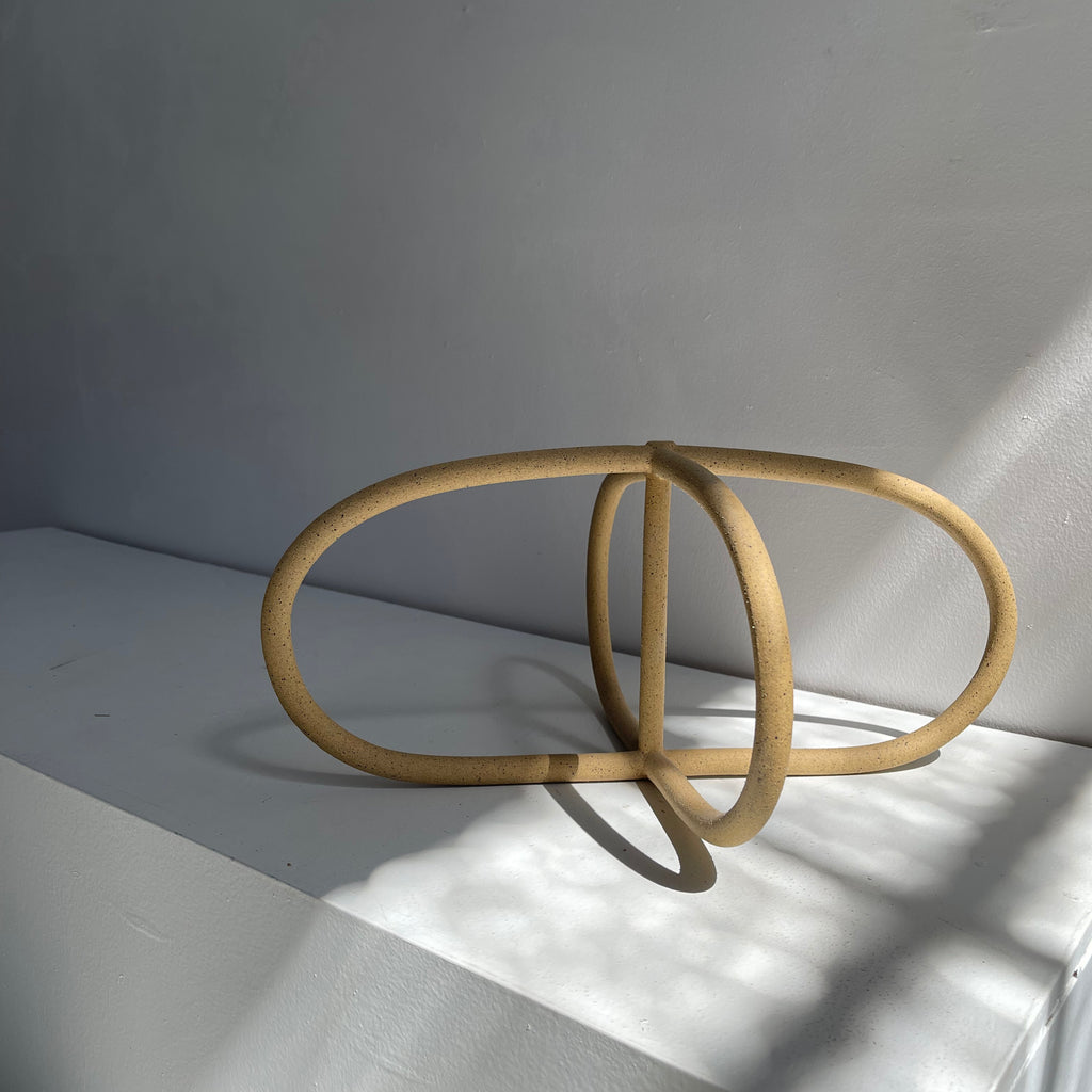 Coil-built elegance in a minimalist sculpture. Whitney Sharpe of Latch Key has a practice that brings craftsmanship back into the aesthetic of personal and home adornment. 
