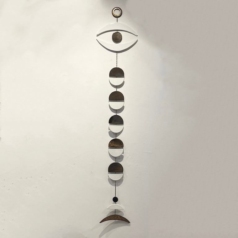 whitney sharpe of the latch key ceramic wall hanging with inspiration of the sun, moon, seasons and mid-century modern ceramic gems