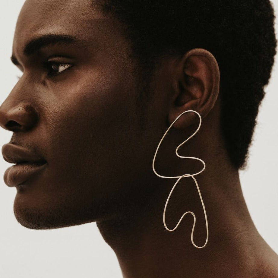 Yellow Jewellery Sculptural Anaid Earrings Doubled up and MIsmatched for Statement Shine shown on model.