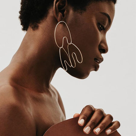 A love story about freedom. The sculptural nature of these delicate earrings flow with the natural curves of the human form.