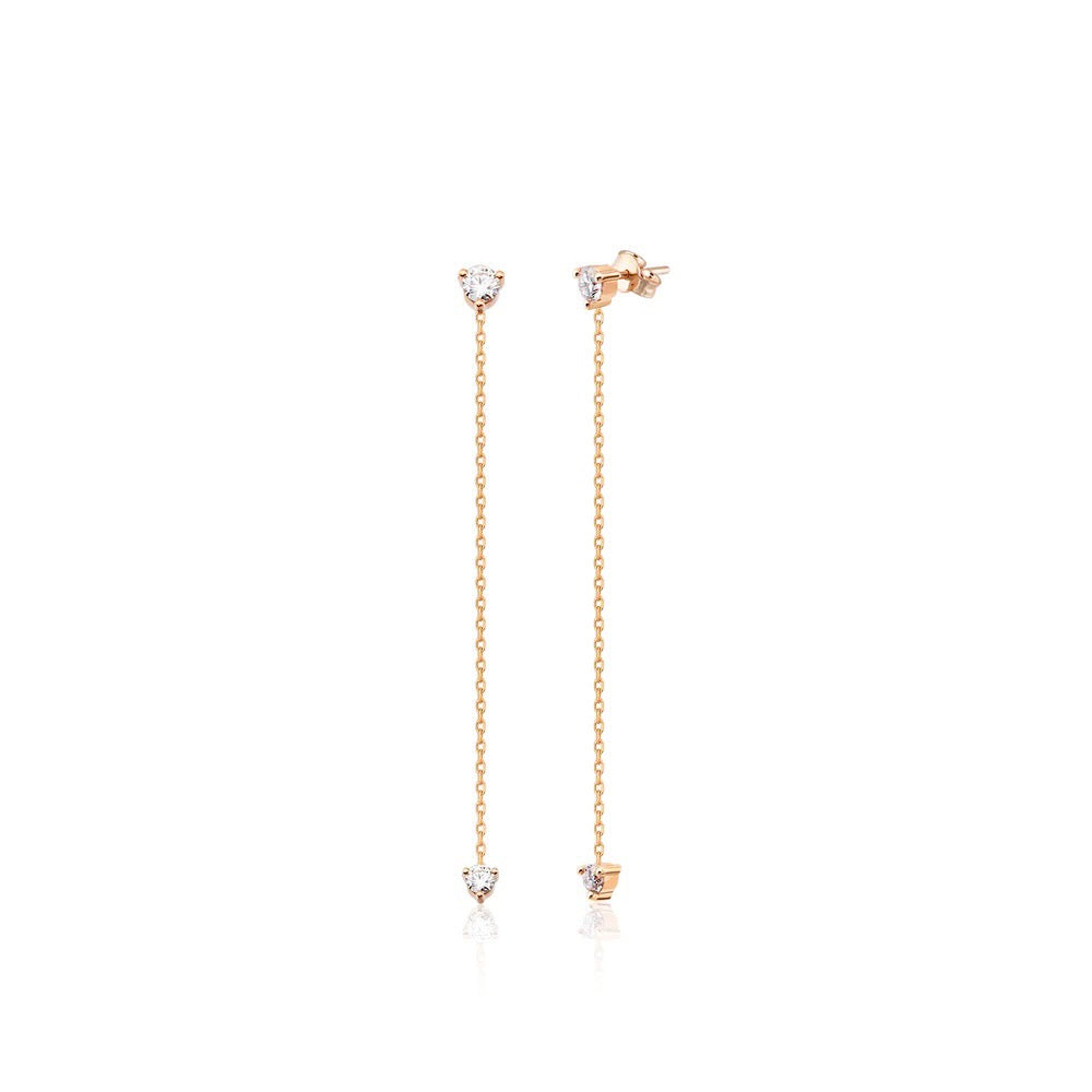 Elegant 14K rose gold studs feature 2 diamonds on each earring –one at the tip and one at the bottom of the chain– and 5.8mm of hanging chain that add extra dimension and a fierce style. 