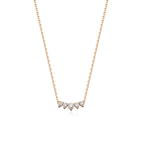 Five diamonds are clustered in a slightly curved bar in this elegant necklace paired with 14K yellow gold chain.