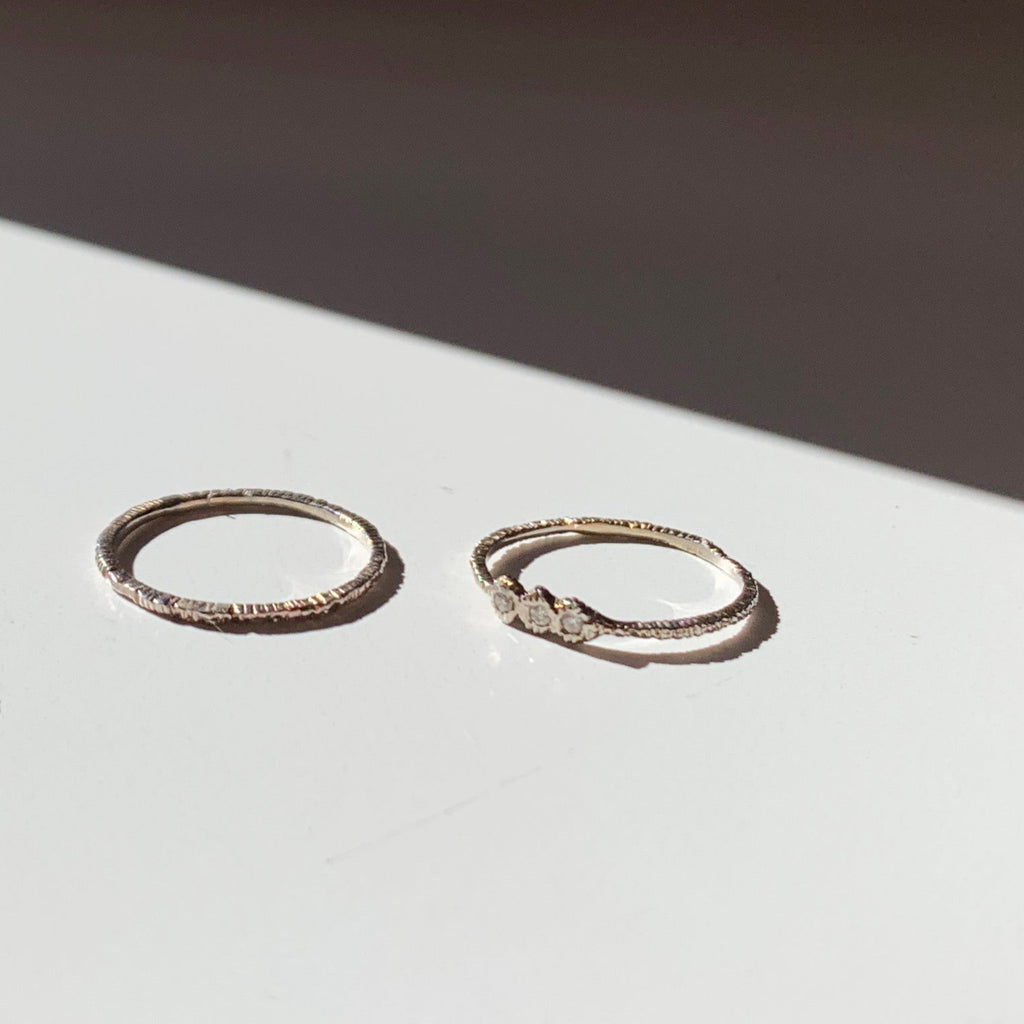A thin textured wedding band or stacking ring by Danielle Welmond to add dimension to any ring stack. 