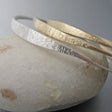 A high tide (“marea alta” in the language of the designer) inspired the design of these unique handmade bangles. The bracelet is elegant by itself, but it creates beautiful “swells” when combined with other "marea alta" bracelets of the same or different metals.