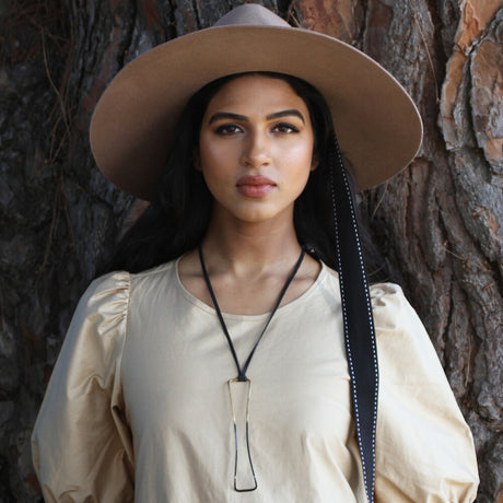 We love the long length and contrasting black on silver on black of this "Oarfish" necklace. Designer Maddalena Bearzi always finds innovative ways to translate nature into her jewelry collection. 