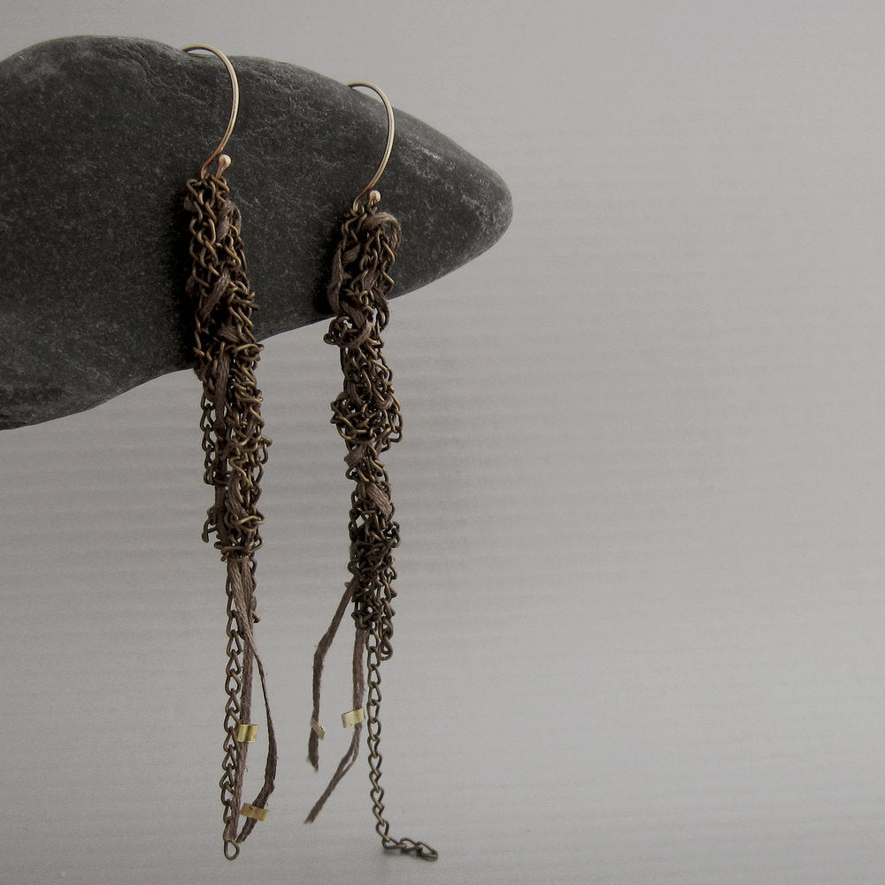 Tiny caterpillars ("bruchini" in the language of the designer) inspired the design of these delicate and light-weight bronze and gold earrings. Hanging with brown thread.